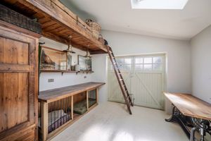 Integral garage currently used as dog room and store- click for photo gallery